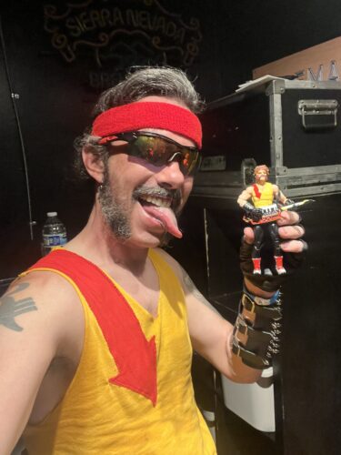 dressed up as Torch holding the toy of Torch